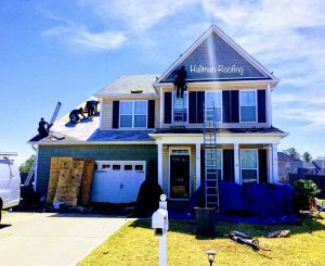 Roofing installation on two story home in Leland